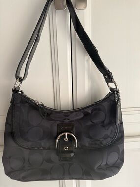 Brand new Coach Soho Signature Black & Silver Flap Hobo Bag. New With Tags